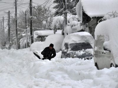 Three dead as first heavy snowfall and blizzards of winter hit eastern Europe