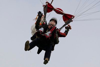 Texas governor skydives for first time alongside 106-year-old World War II veteran