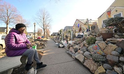 Woman's decades-old mosaic of yard rocks and decorative art work may have to go