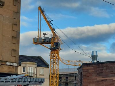 Two injured after crane collapses into newly-built flats in Edinburgh