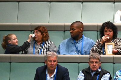 Australia apologizes for thalidomide tragedy as some survivors listen in the Parliament gallery