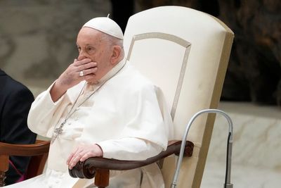 An ailing Pope Francis appears at a weekly audience but says he's not well and has aide read speech