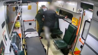 Shocking video shows London paramedic being pushed out of ambulance by patient