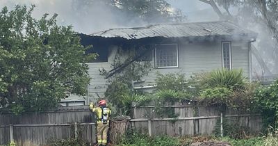 Emergency crews at house fire in Kambah