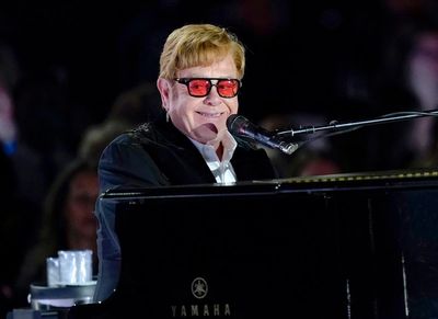 Elton John addresses Britain's Parliament, urging lawmakers to do more to fight HIV/AIDS