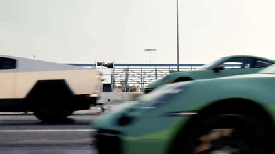 Watch The Tesla Cybertruck Race A Porsche 911 While Towing Another 911