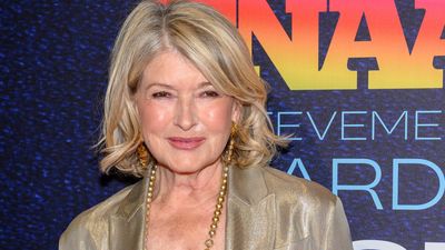 Martha Stewart's plaid puffer jacket and white bobble hat just gave us winter style inspiration to the stars