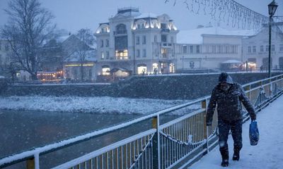 Weather tracker: deaths after first heavy snowfall of winter hits eastern Europe