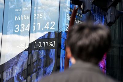 Stock market today: World shares mixed after Wall St ends its best month of '23 with big gains