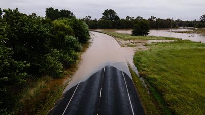 Floods and outages hit two states as deluge persists