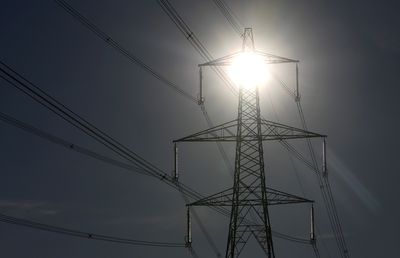 Labour's Pledge to 'Rewire Britain' Sparks Controversy Amidst Tory Party Discord Over Pylon Plans