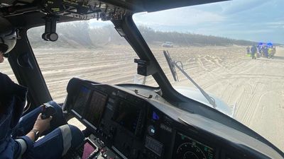 Man airlifted to hospital after being buried in sand