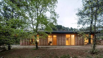 Low-energy house in Catalonia minimises its footprint to make the most of its site