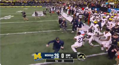 Jim Harbaugh sprinted away from his Gatorade bath after Michigan won the Big Ten