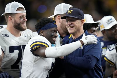 Jim Harbaugh delivered a not-so-subtle dig at his suspension after Michigan won the Big Ten title