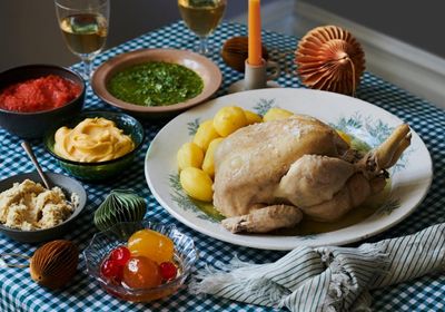 Rachel Roddy’s Christmas recipe for poached chicken with five special sauces