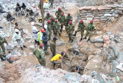 Rescuer raises hope of survivors at a Zambian mine where more than 30 have been buried for days