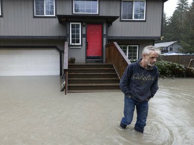 An atmospheric river is soaking the Pacific Northwest with record-breaking rain