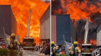 Police pull body from paint factory after massive blaze