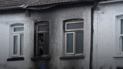Woman charged with manslaughter after deaths of four young brothers in Sutton house fire