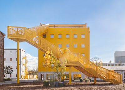 Berlin's Atelier Gardens gets bright yellow focal point within MVRDV masterplan