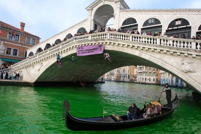 Venice’s Grand Canal dyed fluorescent green by climate activists