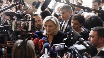 Far-right Le Pen to stand trial on EU embezzlement, fraud charges