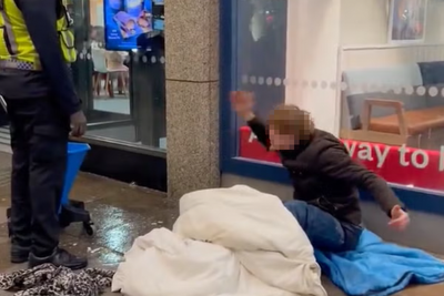 Fury as security guard mops floor where homeless man is sitting outside McDonald’s