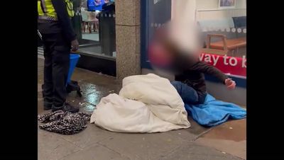 McDonald’s apologises after security guard mops pavement around homeless man