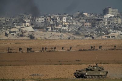 Israel battles militants in Gaza's main cities, with civilians still stranded near front lines