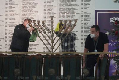 Polish far-right lawmaker extinguishes Hanukkah candle in parliament