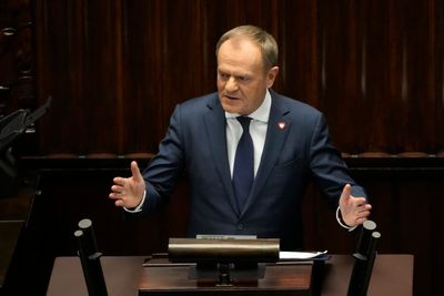 New Polish Prime Minister Donald Tusk is sworn in with his government