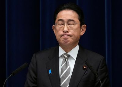 Kishida says he regrets a ruling party funds scandal and will work on partial changes to his Cabinet