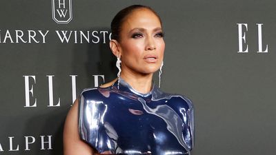 JLo's tartan bra and coat combination with oversized sunglasses is the festive dressing formula we didn't know we needed