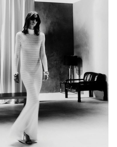Jeanne Cadieu Shines in Striking White Dress and Black Shades