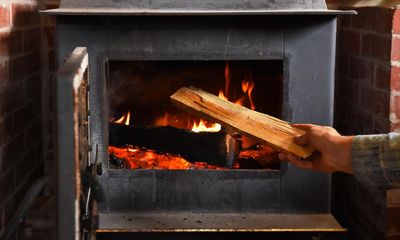 The health cost of burning wood to warm homes