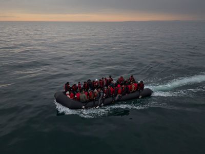 One dead and another fighting for life after small boat carrying 66 migrants sinks in Channel
