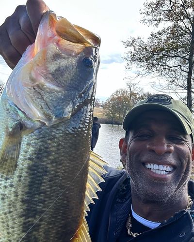 Deion Sanders' Successful Fishing Catch: Enjoyment Beside the Lake