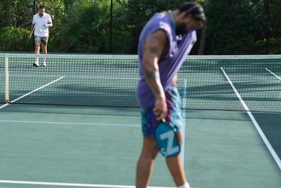 Champagnepapi Embraces Windy Vibes, Sportsmanship on Tennis Court, Hoop Dreams