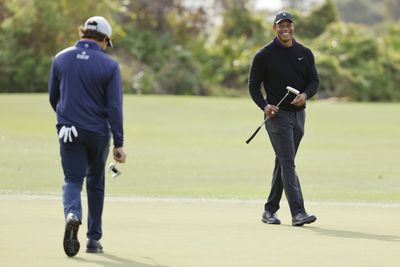 Tiger Woods hilariously threw a chicken tender to try and distract Charlie mid-interview