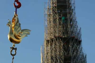 Golden Rooster Fitted To Spire Of Paris's Notre Dame Cathedral