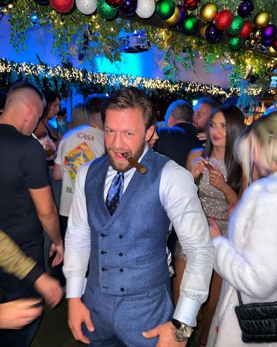 Conor McGregor Enjoys Cigar in Festive Attire at Christmas Celebration