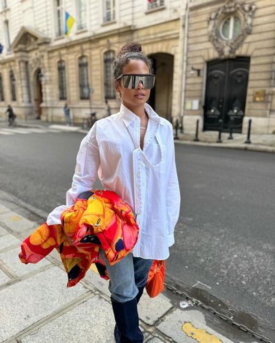 Christina Milian Poses in White Shirt, Blue Jeans, and Shades