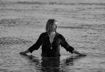 Elegant Kate Winslet Poses in Black Outfit in Standing Water