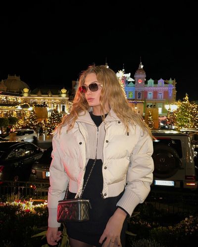 Dayana Yastremska Strikes Poses in Stylish White Puffer Jacket Photoshoot