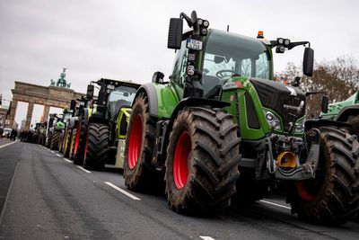 Farmers protest against a German government plan to cut tax breaks for diesel