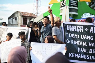 Hundreds of residents on Indonesian island protest the growing arrival of Rohingya refugees by sea