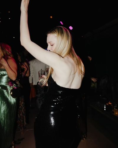 Dakota Fanning Shines in Captivating Black Dress at Wedding Party