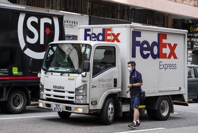 FedEx tumbles after slashing full-year sales forecast in 'volatile' economy