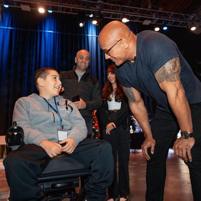 Special Moment: Dwayne Johnson Creates Timeless Joy with Young Fan